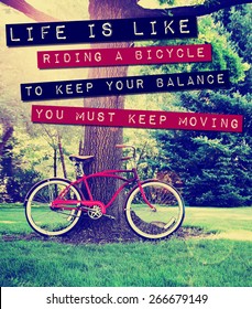 A Quote: Life Is Like Riding A Bike To Keep Your Balance You Must Keep Moving, Over A Bike Photo Toned With A Retro Vintage Instagram Filter App Or Action