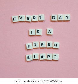 Quotes "Every Day Is a Fresh Start" on pink background. - Shutterstock ID 1242056836