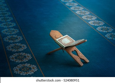 Quran in the mosque - open for prayers - Shutterstock ID 524080951