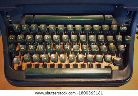 A QWERTY keyboard of a vintage typewriter.