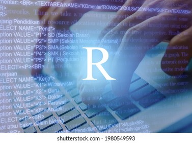 R Programming Language Inscription Against Laptop Computer And Code Background.