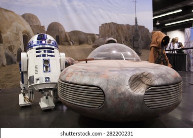 R2D2 With A Land Speeder And A Jawa On Display At The Star Wars Celebration In Anaheim, California, April 2015.