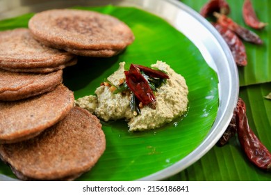 Raagi Dosa Or Millet Dosa, South Indian Famous Breakfast Served In Banana Leaf With Coconut Chutney