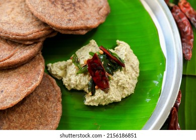 Raagi Dosa Or Millet Dosa, South Indian Famous Breakfast Served In Banana Leaf With Coconut Chutney