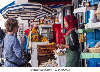 Rabat, Morocco - Oct 13, 2019: A Moroccan Woman Selling Fruits And Herbs At The Busy Outdoor Market In Rabat, Morocco