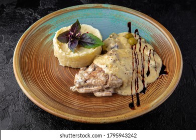 Rabbit In A Creamy Sauce With Mashed Potatoes.