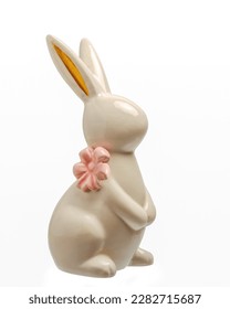   Rabbit with a pink bow, made of ceramics. Easter, decorative souvenir, for a gift and table decoration, isolated on a white background. - Shutterstock ID 2282715687