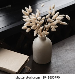 Rabbit Tail Grass Bouquet In Pot, Books Stack On Table 