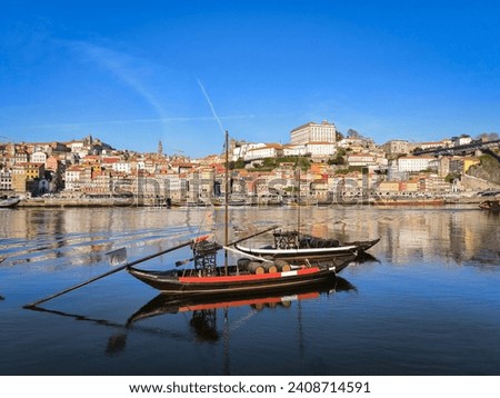Rabelo boat on the Douro river in Ribeira in Vila Nova de Gaia and part of the old city in the background