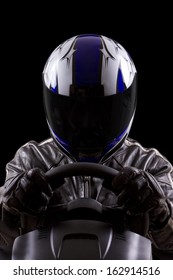race car driver wearing protective leather and helmet