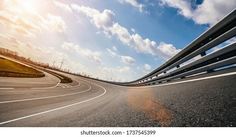 Race Car / motorcycle racetrack after rain on a sunny day. Fast motion blur effect. Ready to race - Shutterstock ID 1737545399