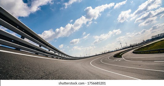 Race Car / motorcycle racetrack after rain on a sunny day. Fast motion blur effect. Ready to race - Powered by Shutterstock