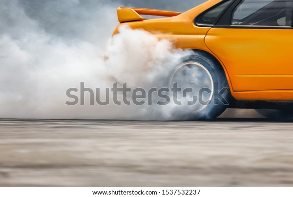 Race drift car\
burning tires on speed\
track