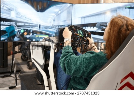 Race driving simulator console player. Virtual driver control and perfomance.