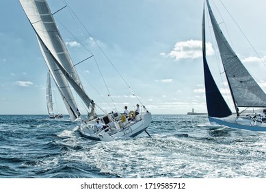 Race Of Sailing Yachts. Sails In The Sea. Yachting