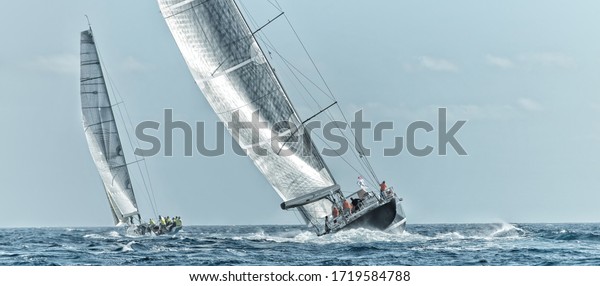 Race of\
sailing yachts. Sails in the sea.\
Yachting