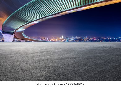 Race Track Road And Bridge With City Skyline At Night In Shanghai.