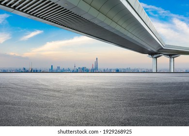 Race Track Road And Bridge With City Skyline At Sunset In Shanghai.