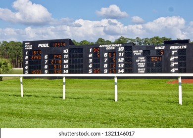 Race Track Tote Board In A Green Field     