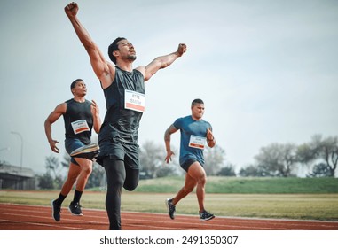 Race, winning and group of men on track for speed challenge, marathon event and celebration. Success, achievement and athlete at stadium for competition, fitness and running champion with arms up