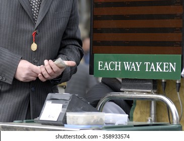 Racecourse Bookmaker With Cash In Hand.                     