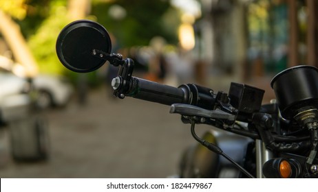 Café Racer Bike With Street On Background. Mirror, Brake, Gas Close Up