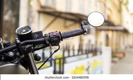 Café Racer Bike With Street On Background. Mirror, Brake, Gas Close Up