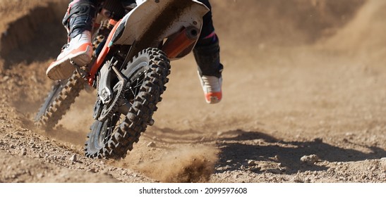 Racer Boy On Motorcycle Participates In Motocross Race, Active Extreme Sport, Flying Debris From A Motocross In Dirt Track