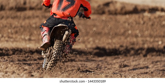 Racer Child On Motorcycle Participates In Motocross Race, Active Extreme Sport