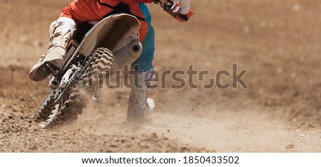 Racer child on motorcycle participates in motocross race, active extreme sport