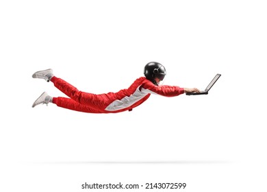 Racer flying and working on a laptop computer isolated on white background