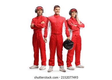 Racer and members of a racing team in red overall suits posing and looking at camera isolated on white background