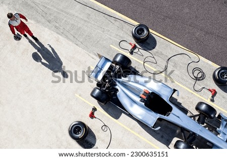 Racer walking to car in pit stop