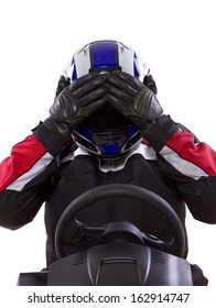 racerwearing red racing suit and blue helmet on a steering wheel
