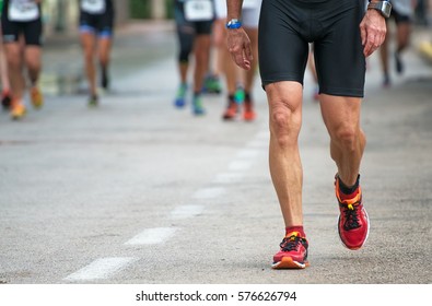 Racewalking. Tired Marathon Runner On The Street.