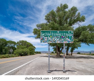 RACHAEL, NEVADA, USA - July 5th, 2019: Extraterrestrial Highway Sign Along Nevada State Route 357 Before Area 51 Has Been Plased With Stickers Partially Obscuring It.