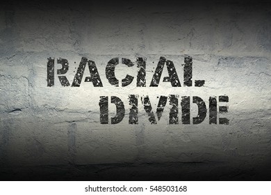 Racial Divide Stencil Print On The Grunge White Brick Wall