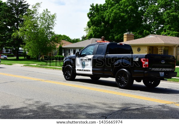 Racine, Wisconsin / USA - June 26, 2019:  Metro Public\
Safety truck participating in a fallen Police Officers funeral\
procession. 