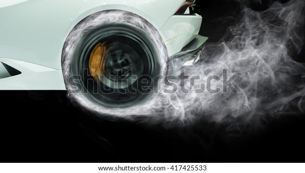 Racing Car\
Burnout isolated on black\
background.