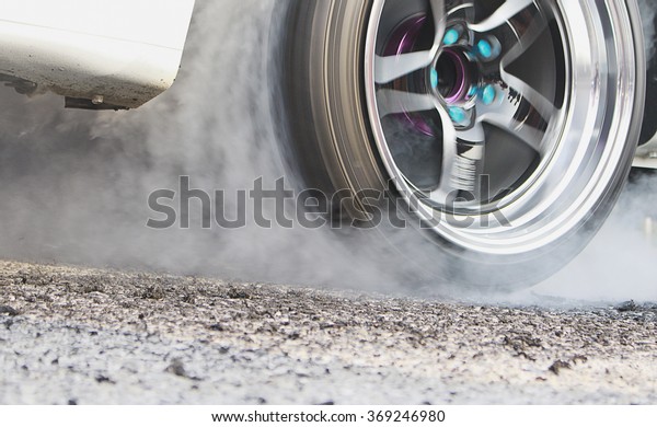 Racing Car Burnout \
The picture is blurred