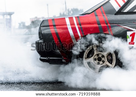 racing car drift in smoke of rubber