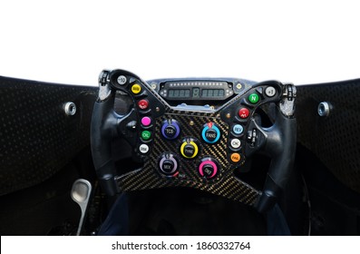 Racing Car Steering Wheel Close Up Shot Under Daylight. Control Unit Before Competition. Many Colorful Buttons . Isolated on White Background