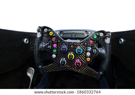 Racing Car Steering Wheel Close Up Shot Under Daylight. Control Unit Before Competition. Many Colorful Buttons . Isolated on White Background