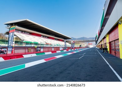 Racing circuit starting straight racetrack large view from pit lane, box and grandstand no people. Mugello, Italy, march 26 2022. 24 Hours series