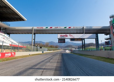 Racing circuit starting straight  view from racetrack center, grandstand and start light and panels, no people. Mugello, Italy, march 26 2022. 24 Hours series