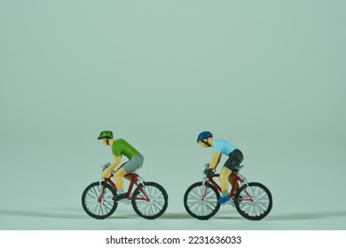 Racing cyclist isolated on light background, view from the side, closeup - Shutterstock ID 2231636033