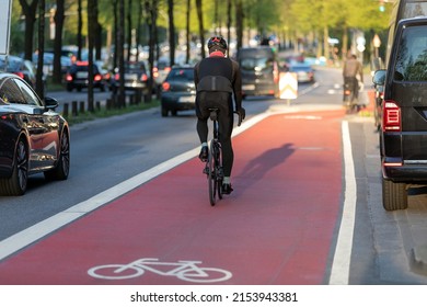 racing cyclist on red bike lane