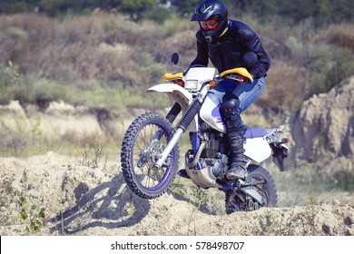 Racing Enduro Motorcycle On A Dirt Track On A Sunny Day.