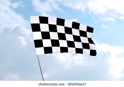 Racing Flag (checkered Flag) In Front Of Blue Sky