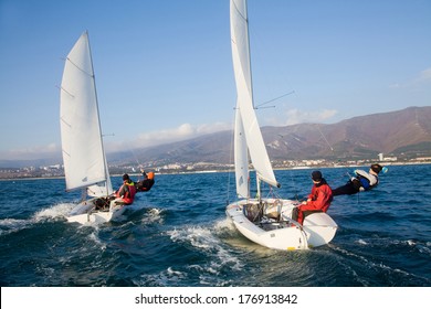 Racing Sailboat In The Sea On A Sunny Day